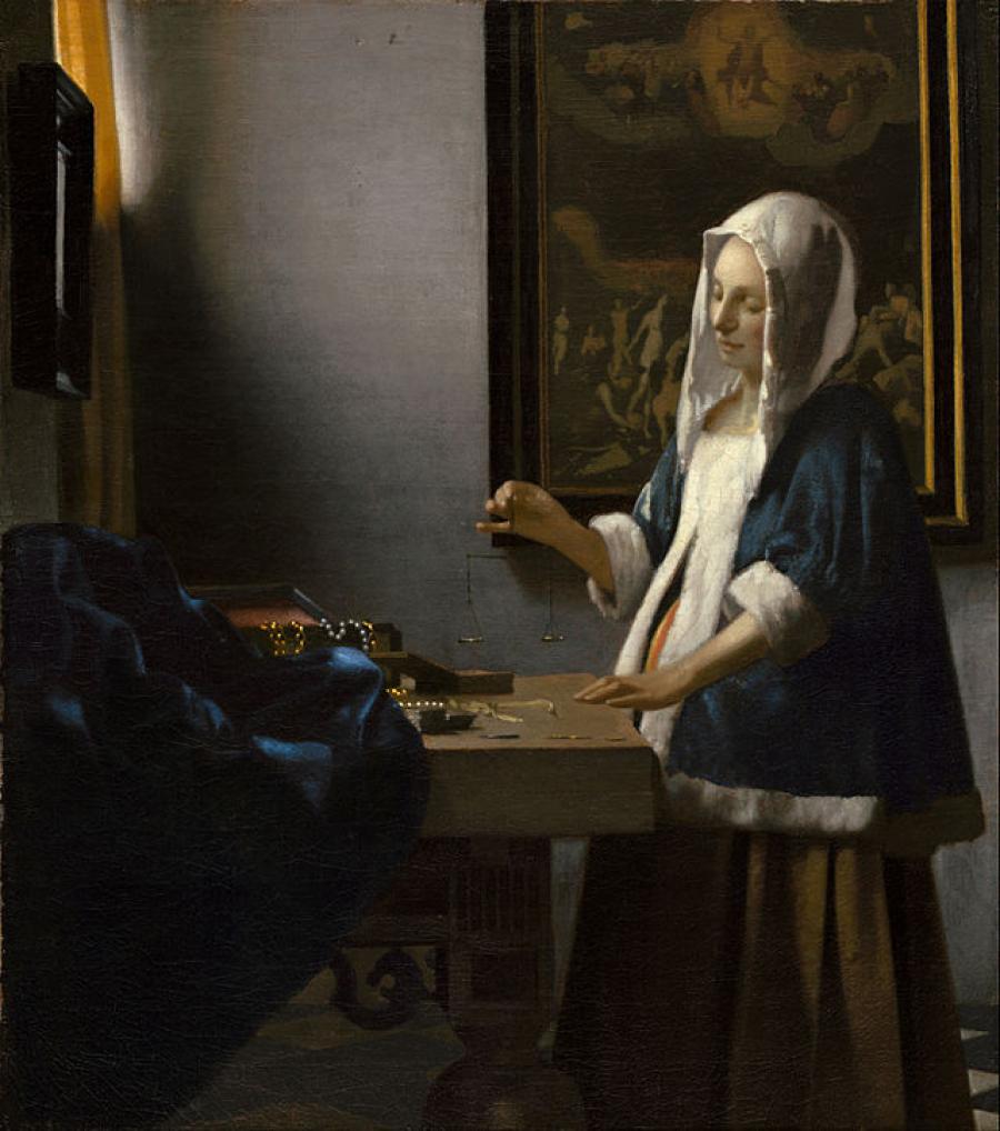 Vermeer kvinde der holder en vægt